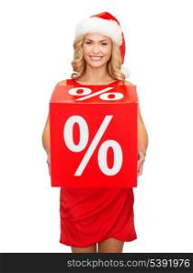 shopping, gifts, christmas, x-mas concept - smiling woman in santa helper hat with red percent sale sign