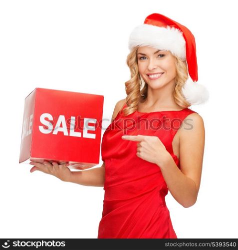 shopping, gifts, christmas, x-mas concept - smiling woman in santa helper hat with red sale sign