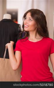 Shopping Girl Portrait. Beautiful Woman with Shopping Bags in Shopping Mall. Shopper. Sales. Shopping Center