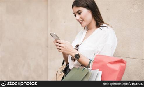shopping girl using her mobile phone