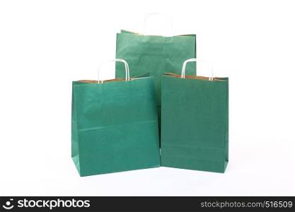 Shopping green gift bags isolated on white background