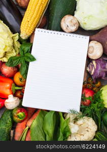 Shopping list on the vegetables with copy space. Vegetables on wooden table