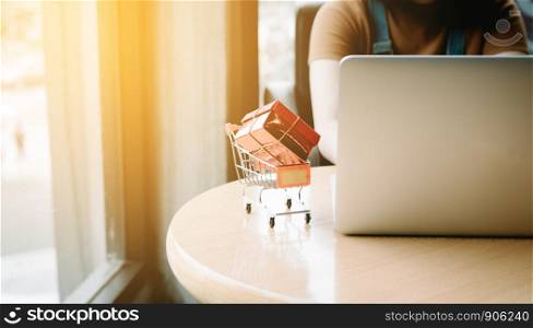 Shopping online concept with woman using laptop for shopping online.