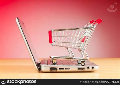 Shopping online with computer and cart