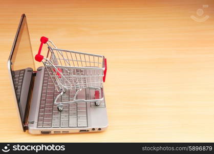 Shopping online with computer and cart