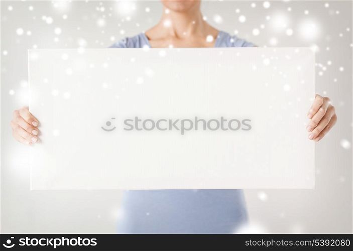 shopping, sale, advertisement, christmas, x-mas concept - woman hands showing white blank board