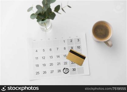shopping, sale and marketing concept - black friday date on calendar, credit card and cup of coffee. black friday on calendar, credit card and coffee