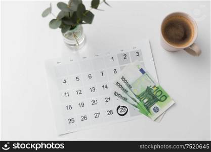 shopping, sale and marketing concept - black friday date on calendar, money and cup of coffee. black friday date on calendar, money and coffee
