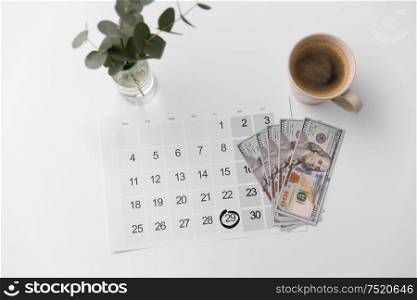 shopping, sale and marketing concept - black friday date on calendar, money and cup of coffee. black friday date on calendar, money and coffee