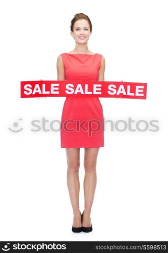 shopping, sale, gifts, christmas and holidays concept - smiling woman in red dress with sale sign
