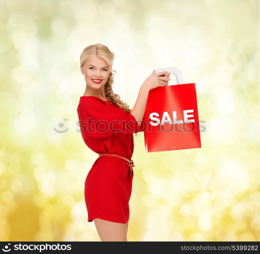 shopping, sale, gifts, christmas, x-mas concept - smiling woman in red dress with shopping bags