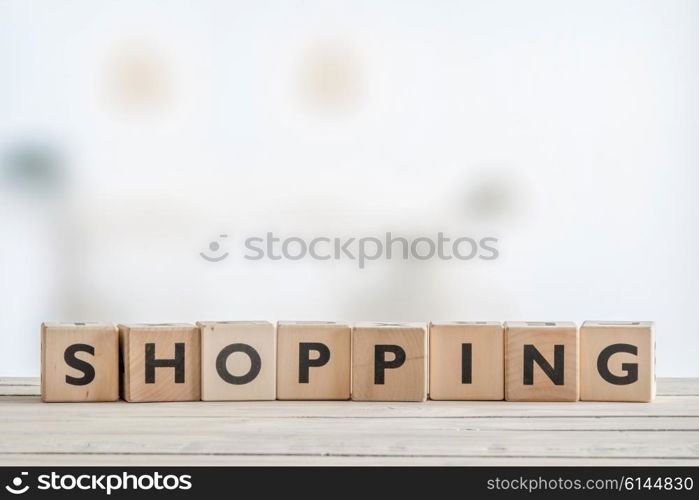 Shopping sign on a wooden table in bright daylight