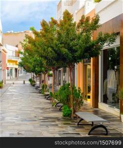 Shopping street in central touristic district of Paphos with green trees, Cyprus