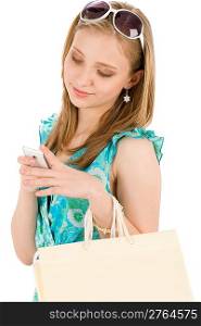 Shopping teenager happy woman with mobile phone in summer dress