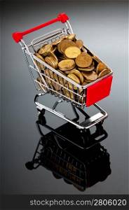 Shopping trolley full of golden coins