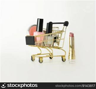 Shopping trolley full of make up and cosmetic goods on white background. Black friday concept. Sale and discount concept. Goods for women. Closeup of a basket with products for make-up.. Shopping trolley full of make up and cosmetic goods on white background. Black friday concept. Sale and discount. Goods for women. Closeup of a basket with products for make-up.