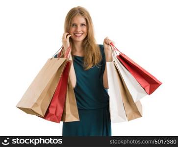 Shopping woman holding shopping bags looking at camera on white background at copy space.
