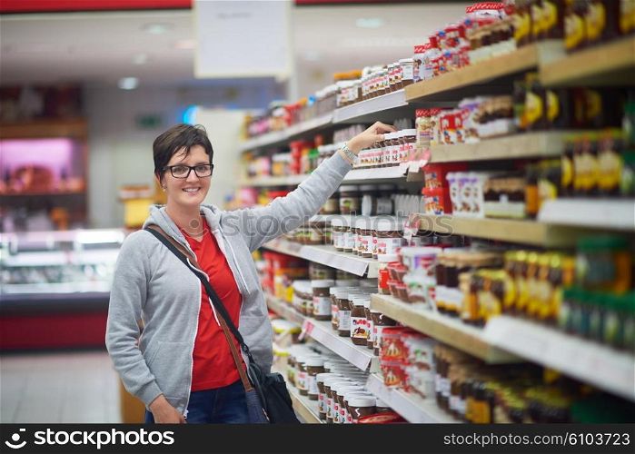 shopping woman in supermarket store buying food and grocery