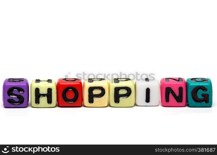 shopping - word made from multicolored child toy cubes with letters