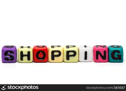 shopping - word made from multicolored child toy cubes with letters