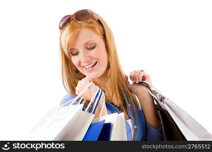 Shopping young happy woman with paper bag on white