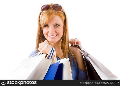 Shopping young happy woman with paper bag on white