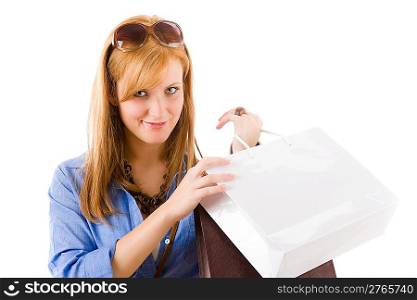 Shopping young woman with paper bag on white