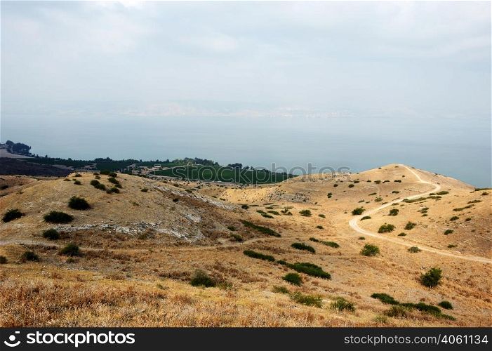 Shore of Lake Kinneret, the slopes of the Golan Heights in Israel. Slopes of the Golan Heights