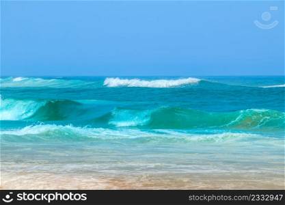 Shore of the Atlantic Ocean and blue sky. Surf. Surf on the Atlantic Ocean