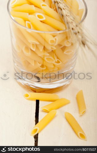 short Italian pasta penne with durum wheat grains