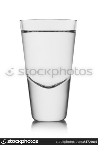 Shot glass of pure clear cold vodka and tequila on white background.