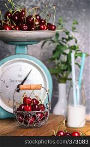 shot in vintage style - red cherry and old vintage scales