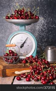 shot in vintage style - red cherry and old vintage scales