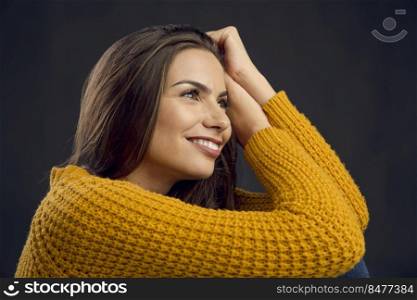 Shot of a beautiful young woman smiling to teh camera and smiling