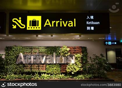 Shot of a directional sign in the Singapore Changi Airport.