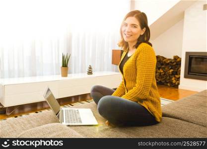 Shot of a gorgeous woman using a laptop indoors