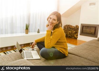 Shot of a gorgeous woman using a laptop indoors