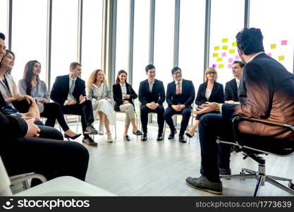 Shot of a group of businesspeople having a discussion in an office