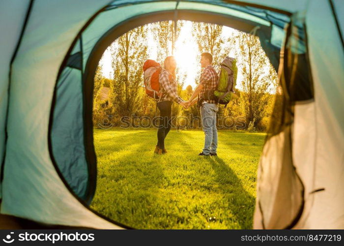 Shot of a happy couple c&ing on the nature