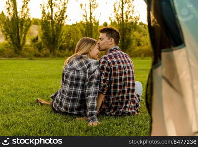 Shot of a happy couple c&ing on the nature