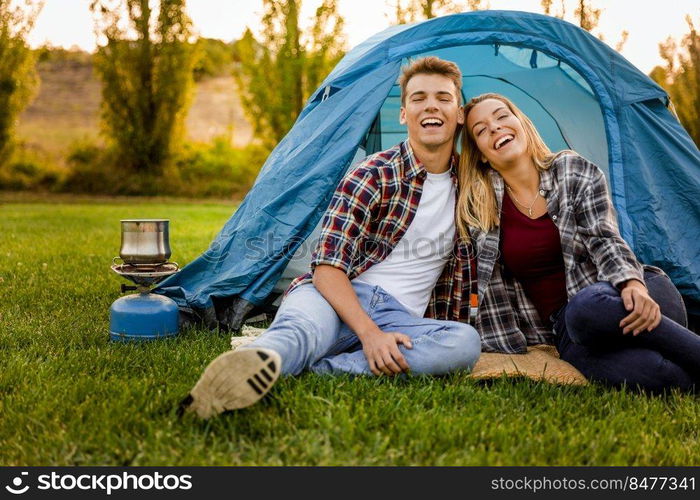 Shot of a happy couple c&ing on the nature 