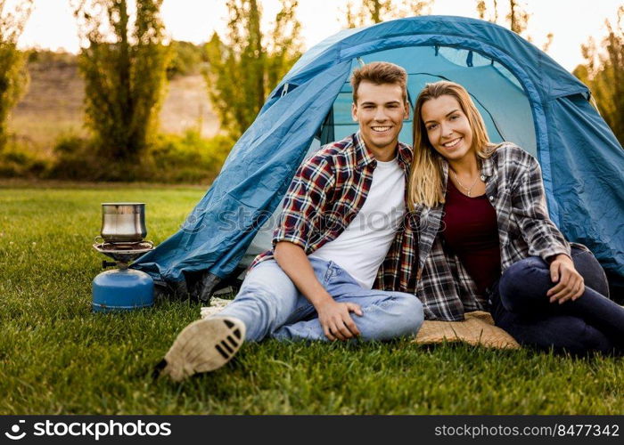 Shot of a happy couple c&ing on the nature 