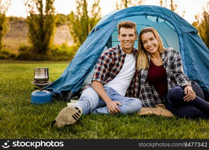 Shot of a happy couple c&ing on the nature 