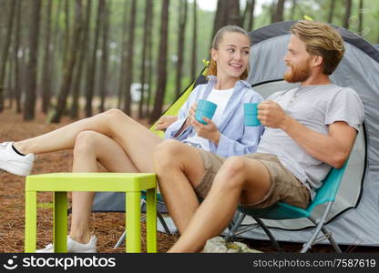 shot of a happy couple camping on the nature