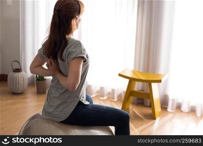 Shot of a woman doing exercise at home
