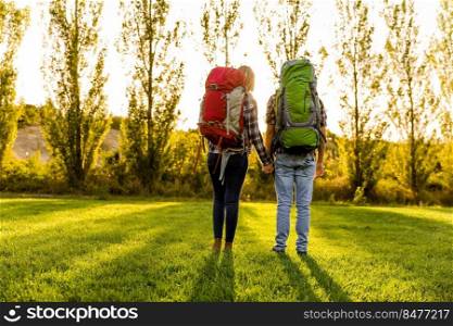 Shot of a young couple with backpacks ready for c&ing