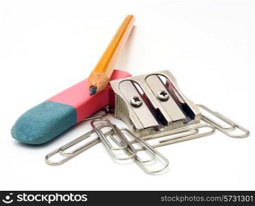 shot of eraser, pencil and pencil metal double sharpener on a white background