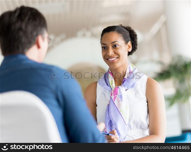 Shot of two young professionals having a discussion at a desk