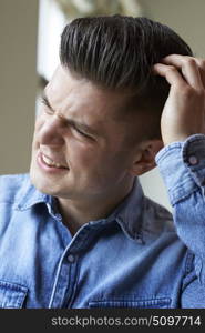 Shot Of Young Woman Itching Scalp