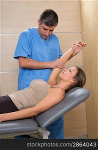 Shoulder physiotherapy doctor therapist and woman patient at hospital